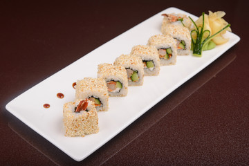 Sushi rolls on a white plate