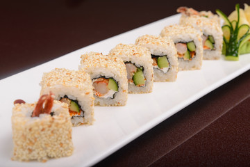 Sushi rolls on a white plate