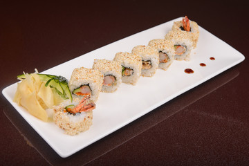 Sushi rolls on a white plate