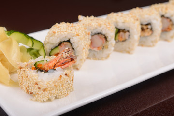 Sushi rolls on a white plate