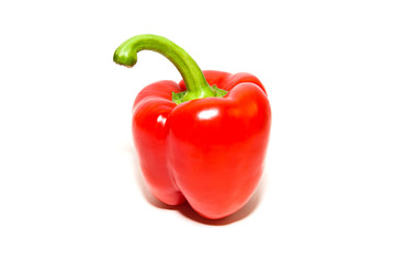 The fruit of red paprika pepper on white