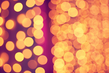 Christmas abstract shiny light bokeh in violet pink colors, vintage retro hipster seasonal holiday background