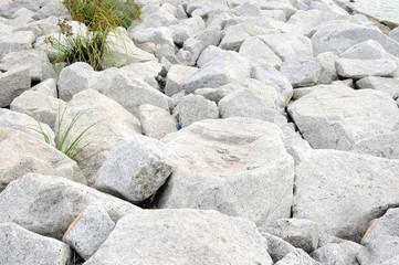 Big rock for breakwater in Thailand ocean.