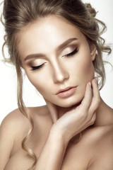 Beautiful woman portrait with nude make up on white background.