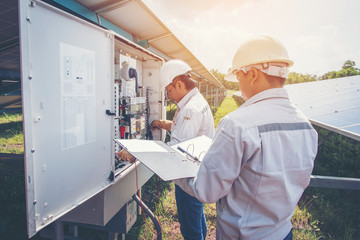 an engineer working on checking and maintenance equipment in solar power plant