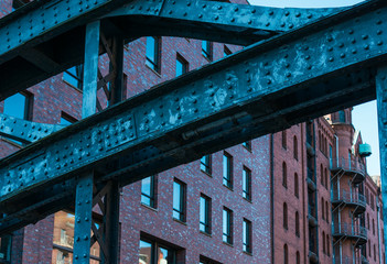 View of buildings through steel bridge