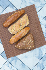 Bread with sunflower seeds and sesame seeds on a wicker napkin