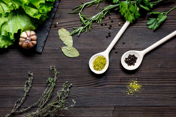 spices and fresh herbs on wooden table top view