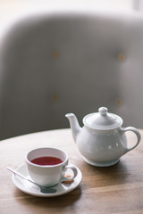 Still life details, cup of tea on a coffee table in living room