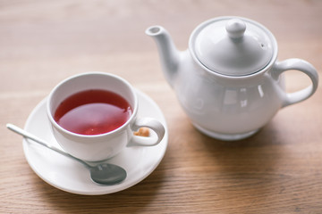 Still life details, cup of tea on a coffee table in living room