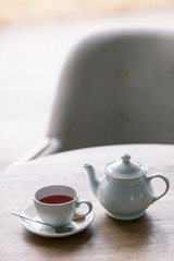 Still life details, cup of tea on a coffee table in living room