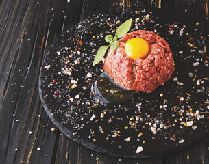 Steak tartare of raw minced meat with salt and spices