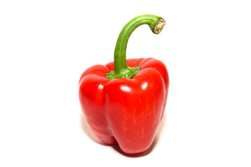 The fruit of red paprika pepper on white