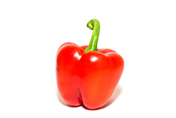 The fruit of red paprika pepper on white