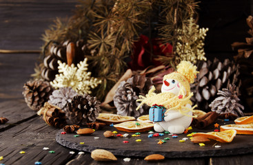 Fototapeta na wymiar figurine Snowman on Christmas BACKGROUND , selective focus