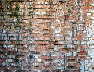 Old weathered red brick wall.