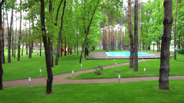 the Lawn Between the Trees With a Swimming Pool
