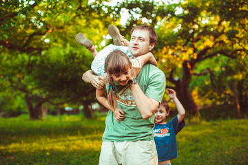 Fototapeta premium dad playing with his favorite daughter outdoors