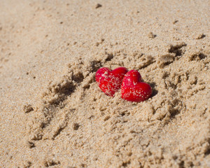 Red hearts on the beach. Couple in Love Valentines Day concept.