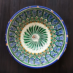 typical central asian bowl on dark brown table
