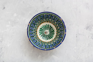 traditional central asian bowl on concrete plate