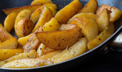 potatoe wedges in a pan