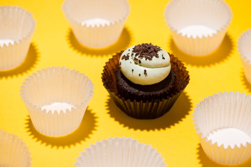 Birthday cupcake against a yellow background