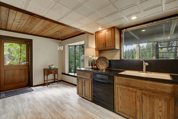 Kitchen cabinets close up with black counter top