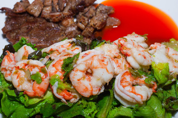 Grilled meat and shrimps with vegetables, barbecue grill food