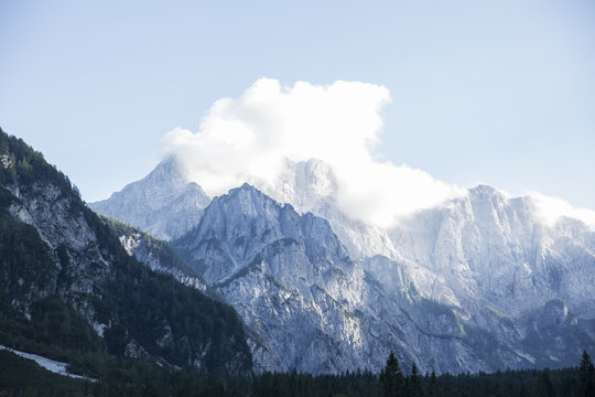Mountains covered with white clouds under blue sky from Planica