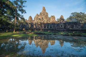 Fototapeta na wymiar The Bayon is a well-known and richly decorated Khmer temple at Angkor in Cambodia. Built in the late 12th or early 13th century as the official state temple of the King Jayavarman VII.