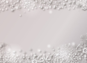 grauer weihnachtlicher Hintergrund mit weißen Schneekristallen