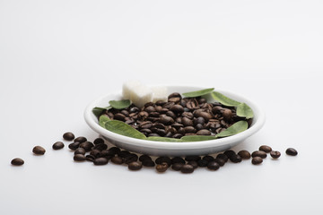 coffee beans lies on plate