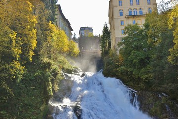 A waterfall plunging through the town Bad Gastein, a famous health resort and also ski resort. Austria, Province of Salzburg, Europe. © utamaria