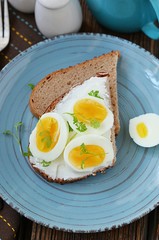 Sandwich with boiled egg and cream cheese for breakfast
