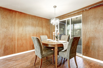 Wooden interior of dining room with romantic table setting