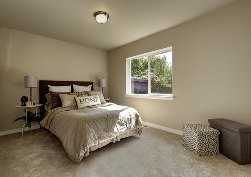 Light tones bedroom interior with large bed