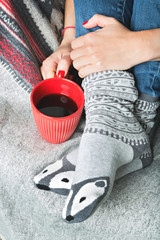 female legs covered with blanket