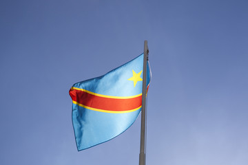 National flag of Congo on a flagpole