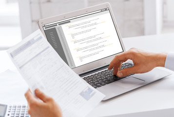 businessman with laptop computer working at office