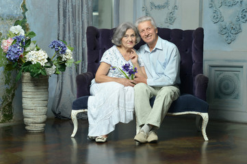 Elderly couple in vintage interior