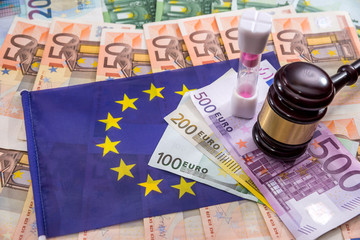 europe flag with euro mmoney and hammer