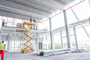 Scissor lift platform on a construction site