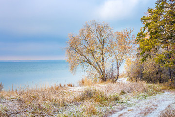 Autumn landscape with first snow in the Siberian river Ob