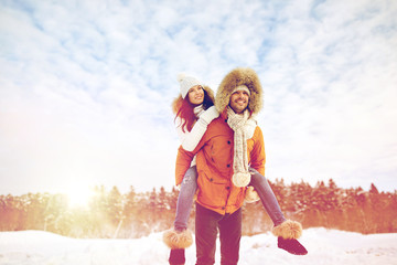 happy couple having fun over winter background