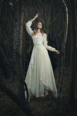 Fototapeta premium Victorian dressed woman levitation