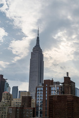 Fototapeta na wymiar Clouds by the Empire Stat Building