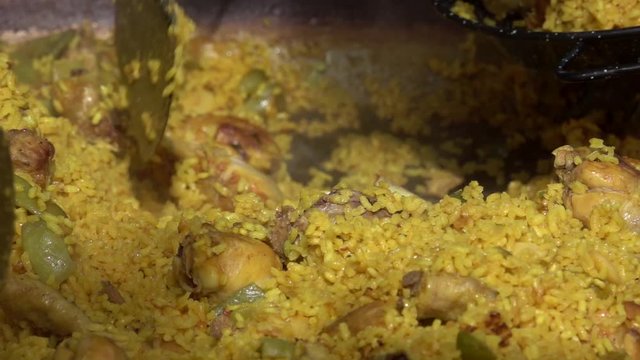 slow motion of chicken paella