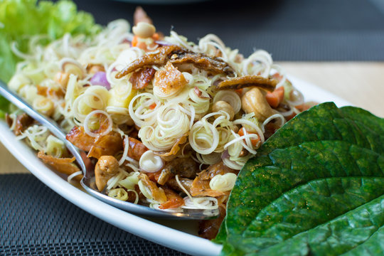 Spicy lemongrass salads with chaplo leaves on the dish
