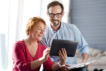 Woman using tablet with her husband